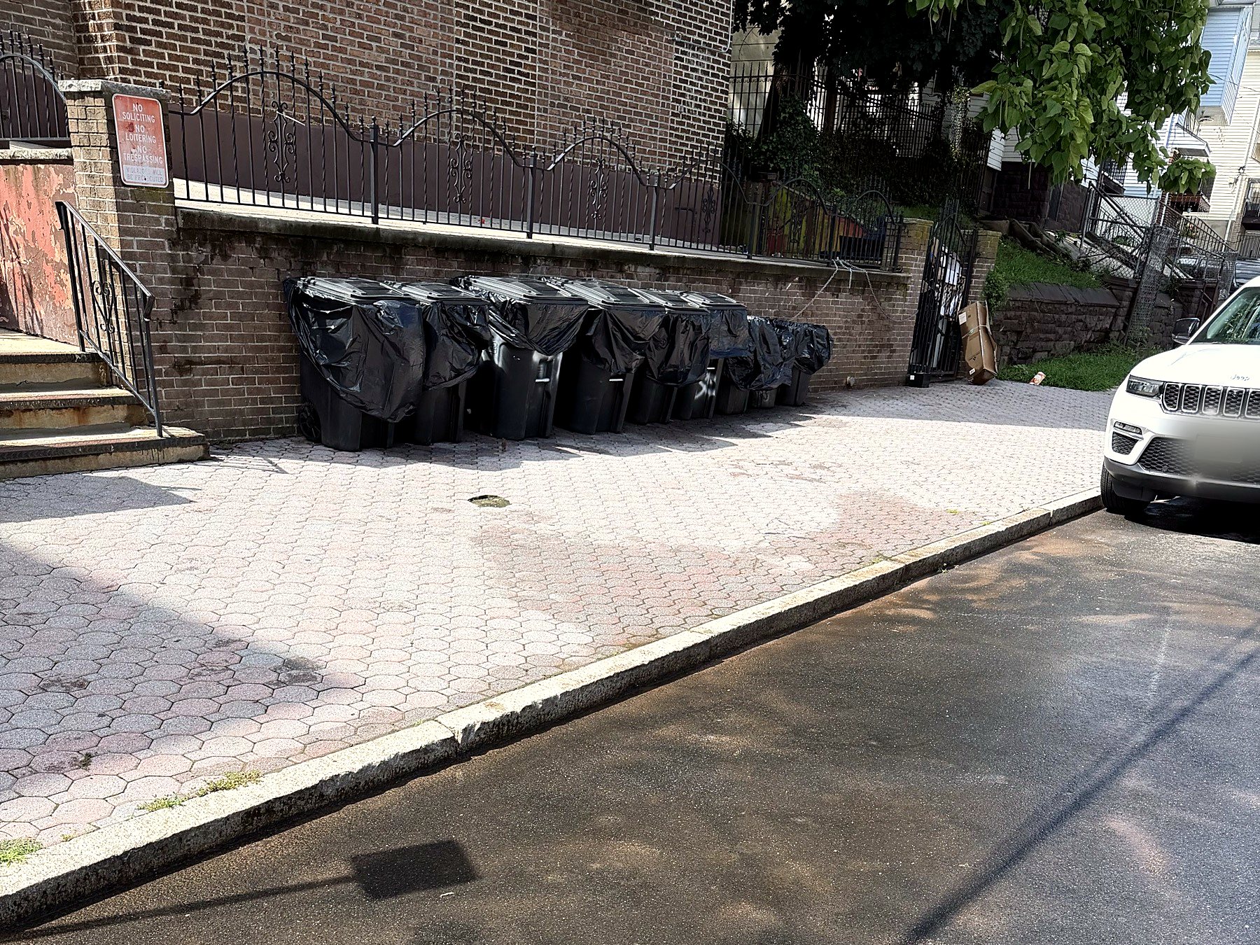 Clear curb and street in front of the building.